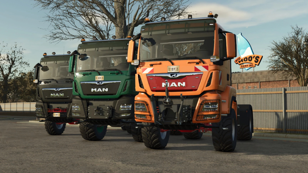 Three MAN TGS 18 Series trucks in different colors, featured in FS25 mods, parked near a fence in Farming Simulator 25.