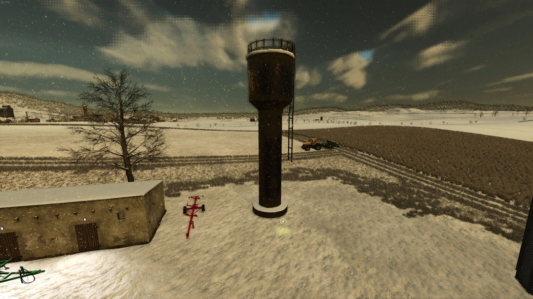 Old deep well mod in FS25 on snowy farm landscape, featuring a tall water tower, barn, and tractor.