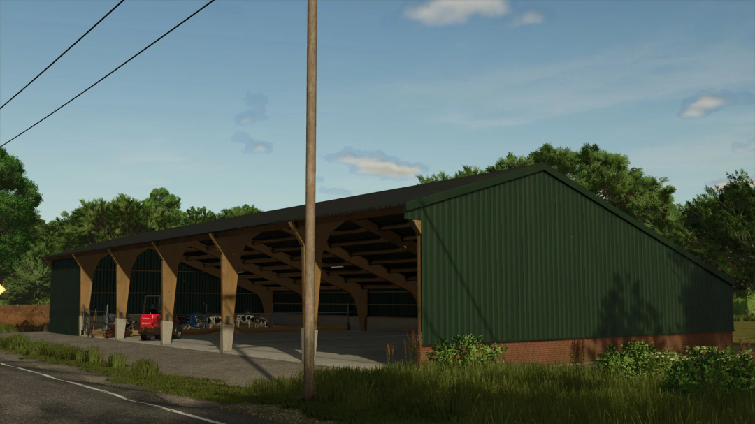 Green farm shed from FS25 Shed Pack v1.0.0.0 mod, with tractors and cows inside, under a blue sky.