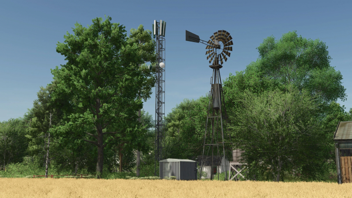 fs25-mods, FS25 mod Cellular Antenna v1.0.0.0 in a rural field with trees and a windmill.