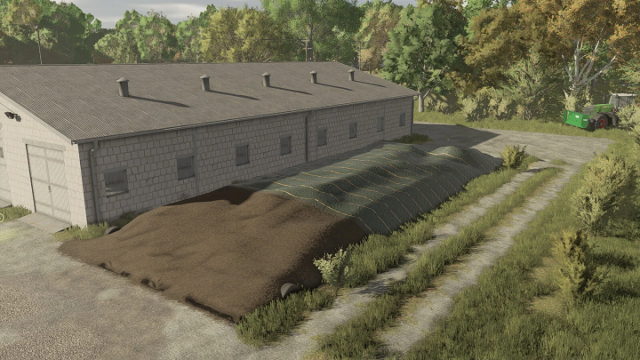 fs25-mods, FS25 Silage Silo Pack v1.0.0.0 mod with a covered silage pit near a barn, surrounded by trees.