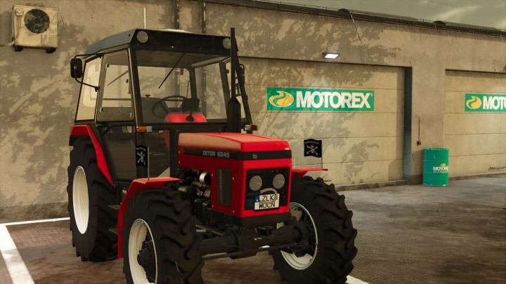 fs25-mods, Zetor 62 7745 Edited v1.0.0.0 mod for Farming Simulator 25, showcasing a red tractor in front of a garage with Motorex signage.