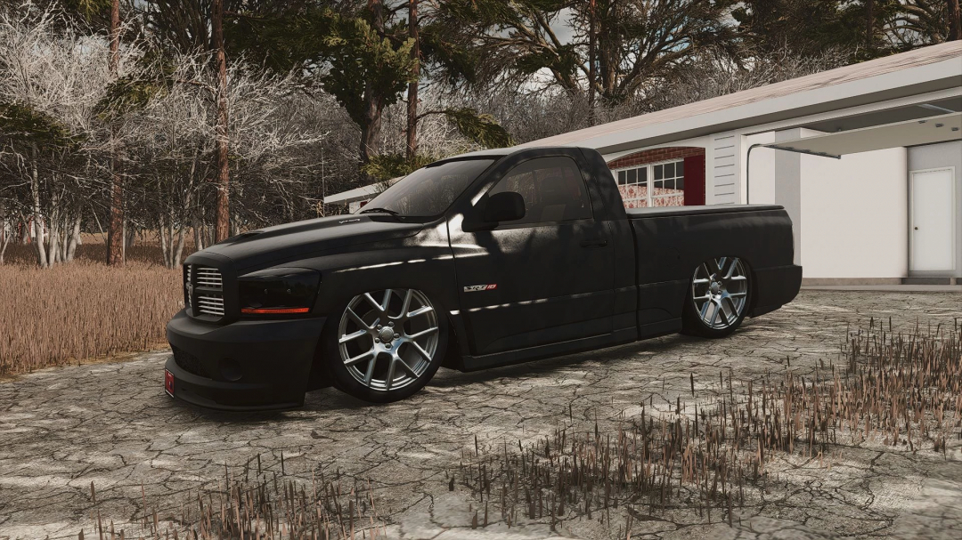 2004 Dodge Ram SRT-10 mod in FS25, displayed near a garage in a rural setting.