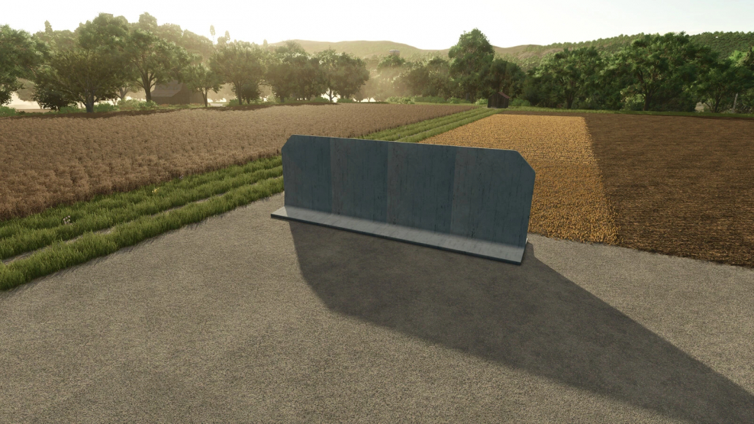 FS25 mod Deko Stones T And L Big Pack 1 in a field setting with trees and farmland, showcasing stone decoration.