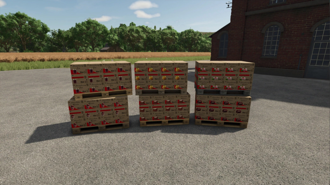 Pallets of packaged goods outside a factory in FS25 Dessert Factory mod.