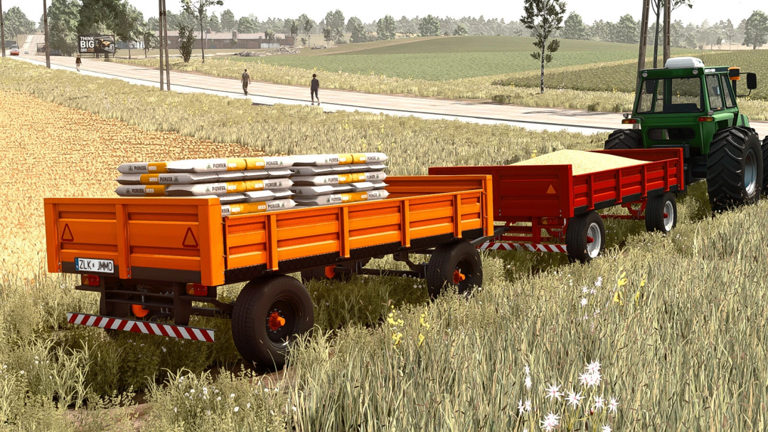 FS25 mod Lizard 4TT v1.0.0.0 trailer, carrying seeds and grains, attached to a tractor in a scenic farm landscape.