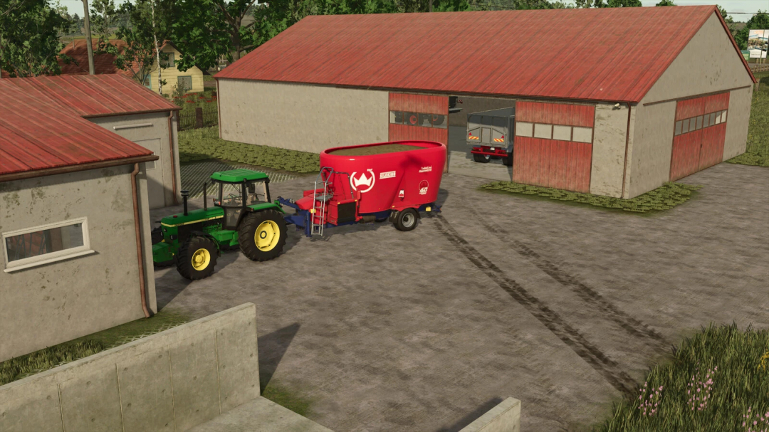 FS25 mods: Green tractor towing red feed mixer at Modern Cow Barn And Garage Pack.