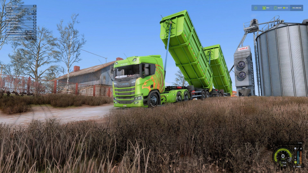 Green truck with RODOTREM BASCULANTE GRANDE mod unloading at silo in FS25.