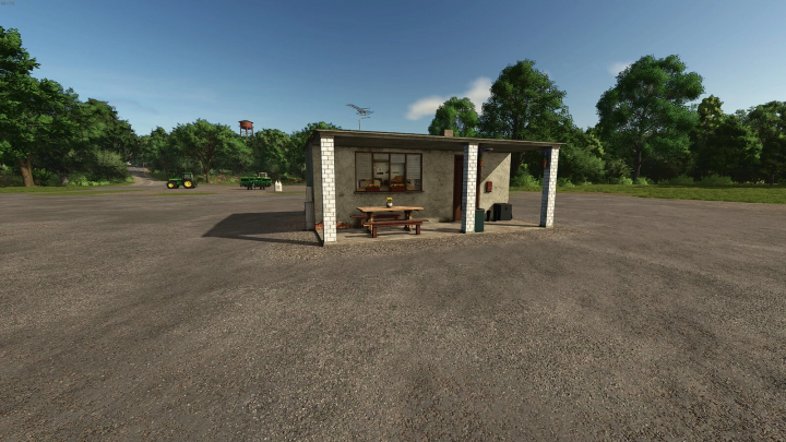 fs25-mods, Gatehouse mod v1.0.0.0 for Farming Simulator 25, featuring a small building with outdoor seating in a rural setting.