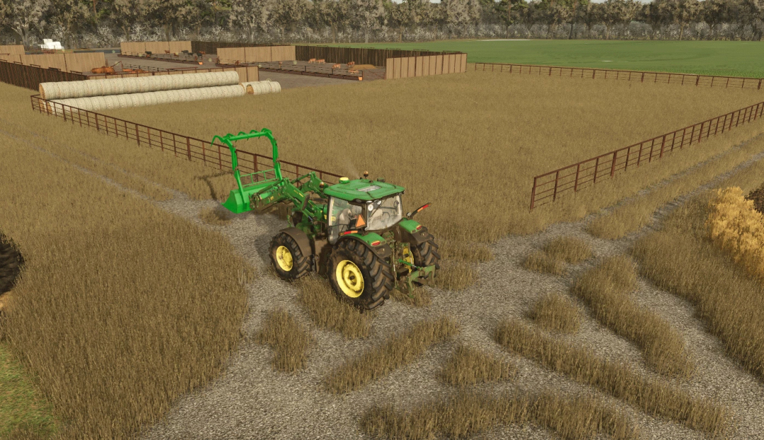 FS25 mod showing a tractor in a fenced field with windbreak panels and hay bales in Farming Simulator 25.