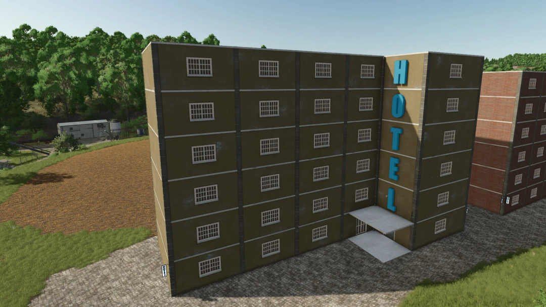 FS25 Hotel mod v1.0.0.0 in-game view, showing a tall building with 'Hotel' sign in rural landscape.