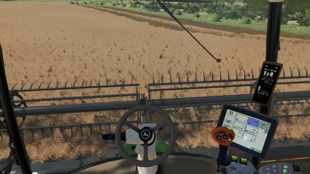 FS22 John Deere W260 cockpit view harvesting field, showcasing mod features in Farming Simulator 22.