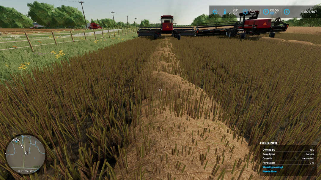 FS22 John Deere W260 harvesting canola in Farming Simulator 22 mods.
