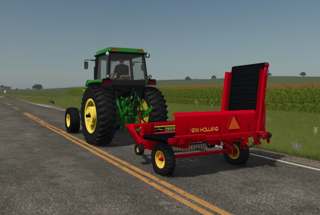 FS25 mod John Deere 4440 with New Holland trailer on a country road.
