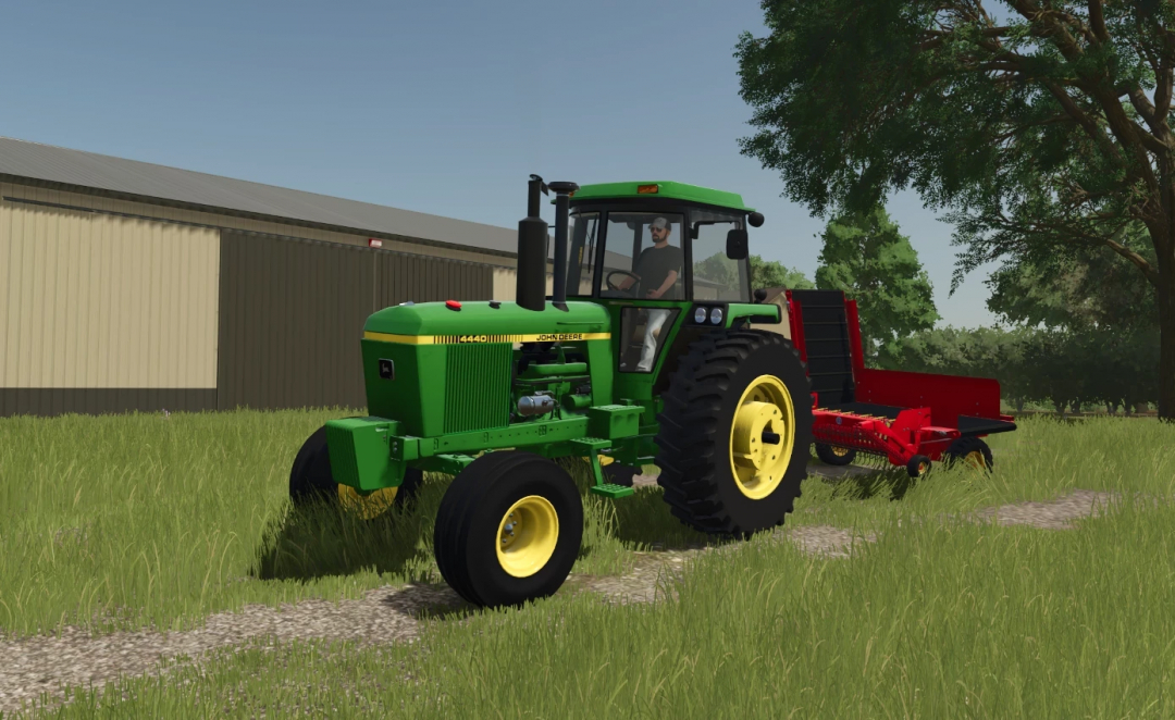 John Deere 4440 tractor mod for FS25 in a field with attached equipment, showcasing Farming Simulator 25 mods.