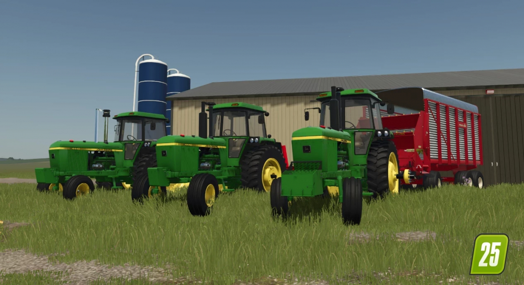 Three John Deere 4440 tractors in green, parked in front of a barn in FS25 mod.