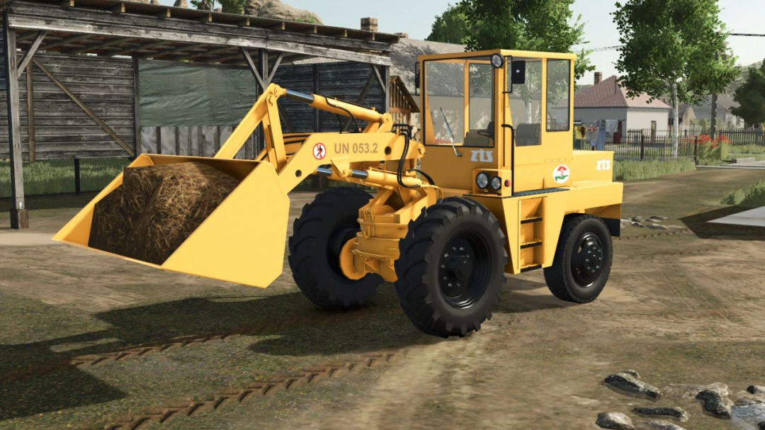 UN 053.2 loader mod in Farming Simulator 25, featuring a yellow vehicle with a hay-filled scoop.