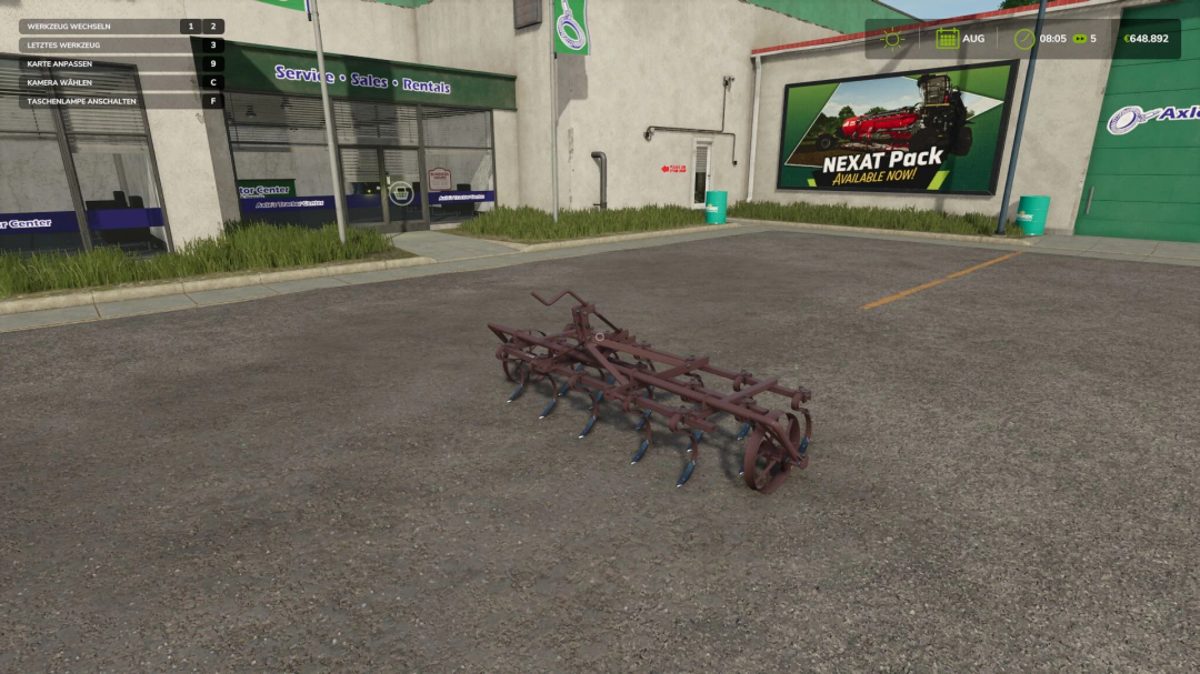 Farming Simulator 25 mod: Unia KLz-3A cultivator on a parking lot in front of an agricultural store.