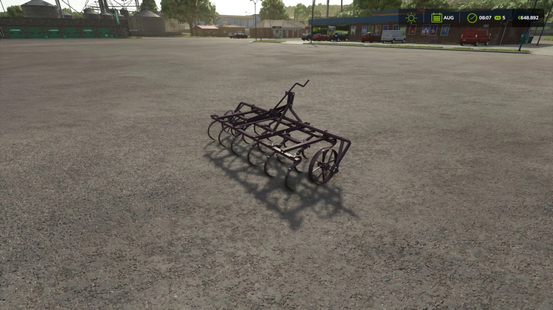 In-game mod image of a black agricultural cultivator for Farming Simulator 25, placed on a gravel surface in the game environment.