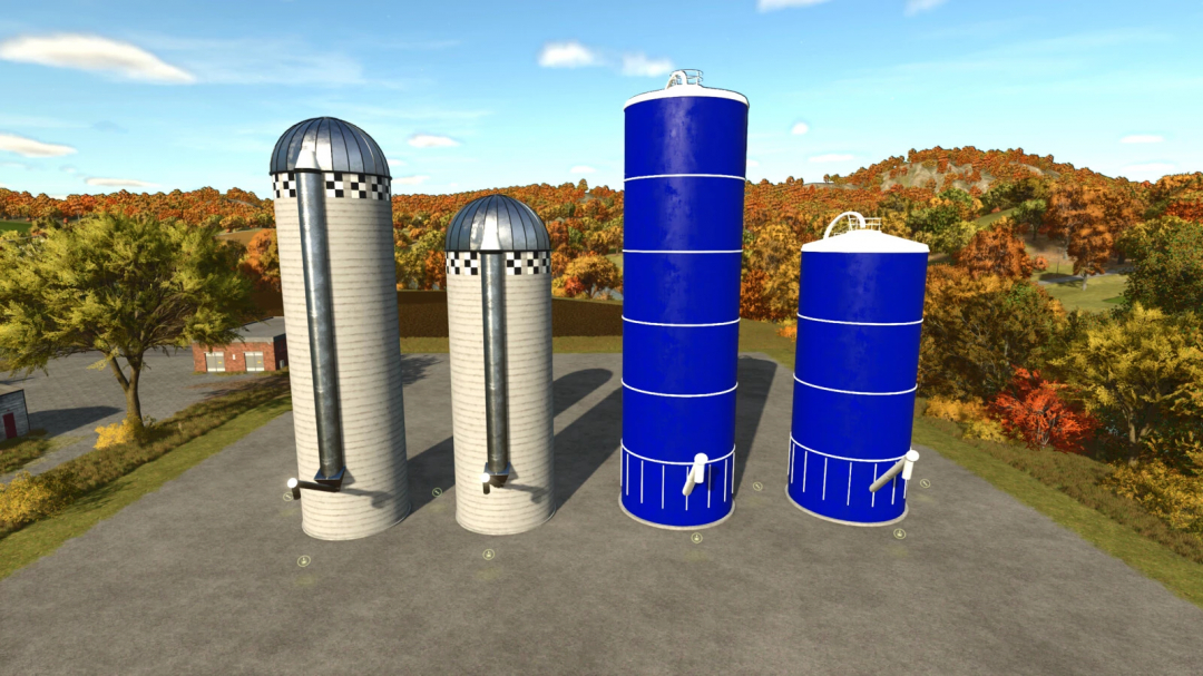 Four colorful silos, two silver with checkered caps and two blue, in Farming Simulator 25 for FS25 mods and farming storage.