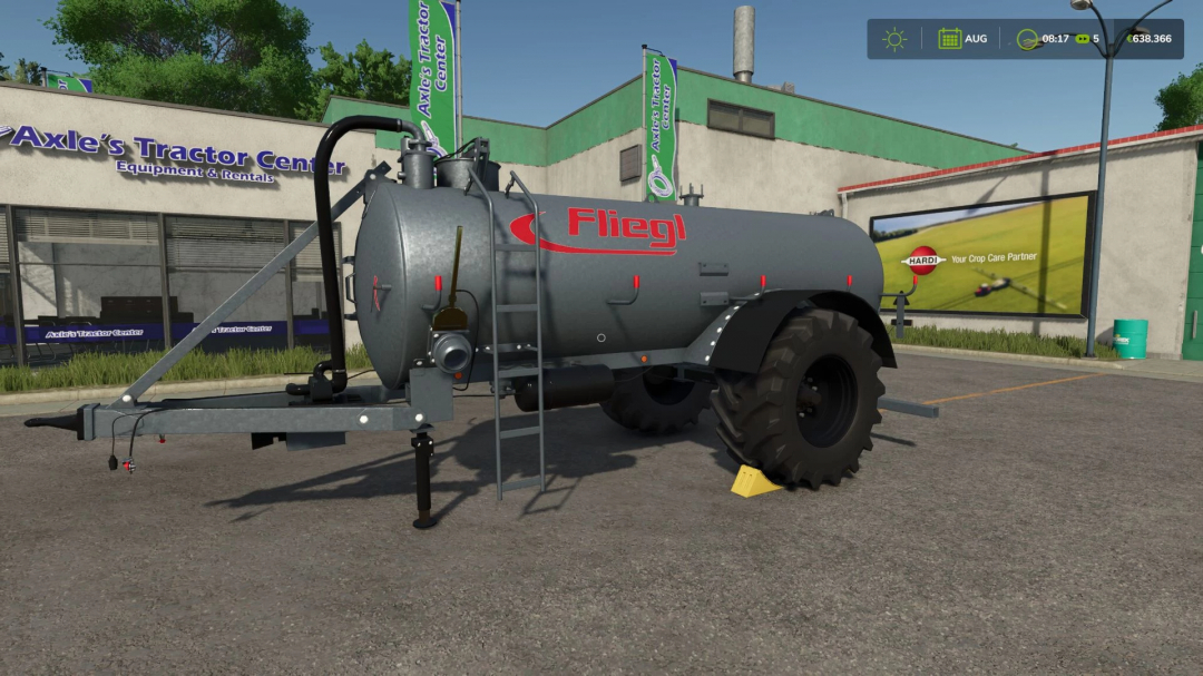 Farming Simulator 25 mod: Fliegl VFW 10600 liquid manure tanker parked outside Axle's Tractor Center.