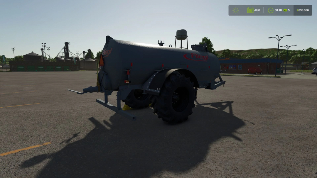 Farming Simulator 25 mod: Fliegl VFW 10600 tank trailer in an outdoor parking lot, used for agricultural transport in FS25 mods.