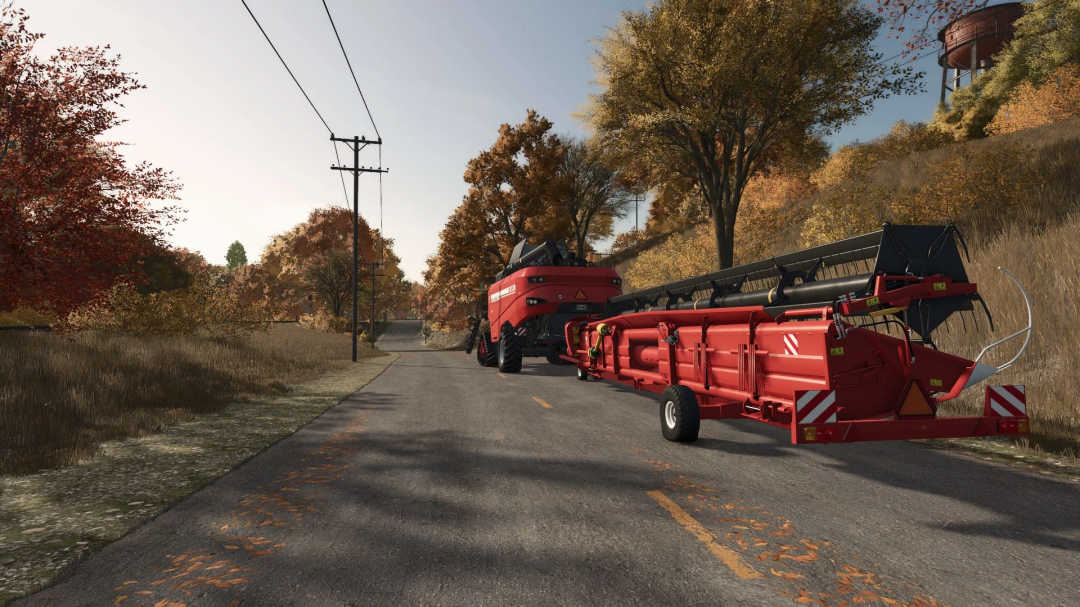 Farming Simulator 25 mod, JSK Pack v1.0.0.0, red harvesting equipment on a rural road with autumn trees, realistic farming machinery.