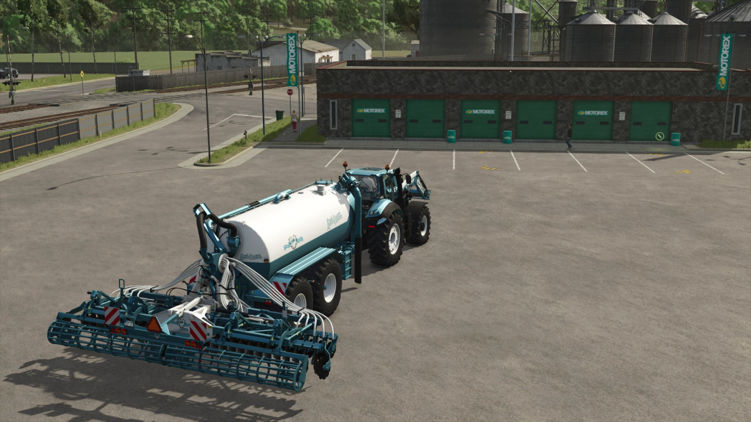 Farming Simulator 25 mod: Kaweco Pack Dolphin Edition v1.0.1.0, tank trailer and agricultural equipment in front of Motorex building.