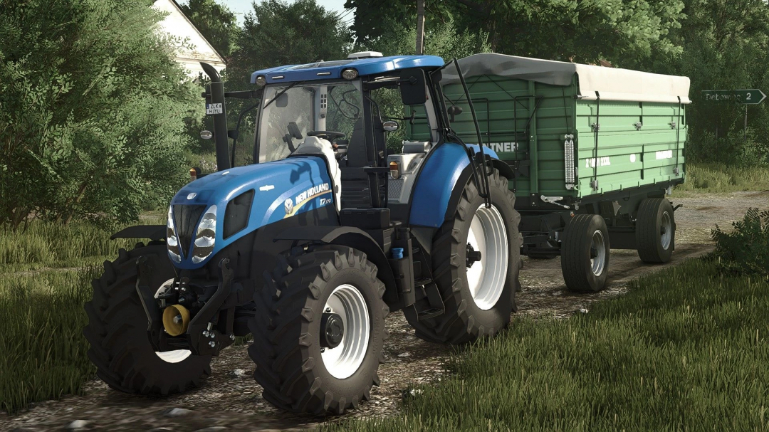 Farming Simulator 25 mod featuring a New Holland T7 2011 Series tractor with a green trailer, on a dirt path among trees.