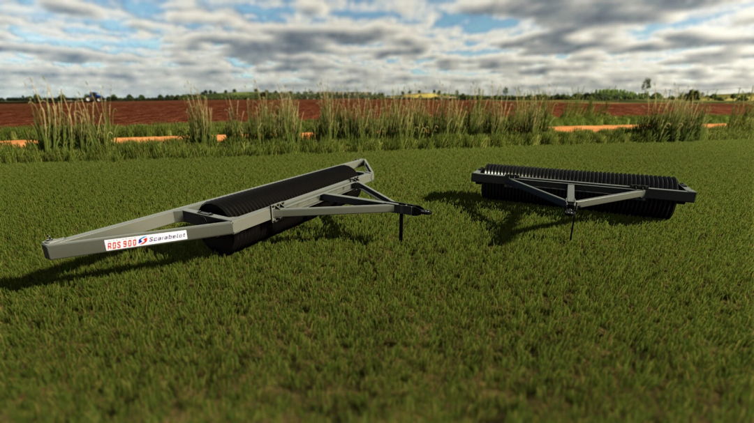FS25 mods: Scarabelot RDS900 Clod Crusher/Compactor for Farming Simulator 25, on green grass with farm fields in the background.
