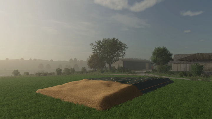 fs25-mods, Farming Simulator 25 mod scene with field silos for silage, lush green field, trees, farm buildings, and a partly cloudy sky.