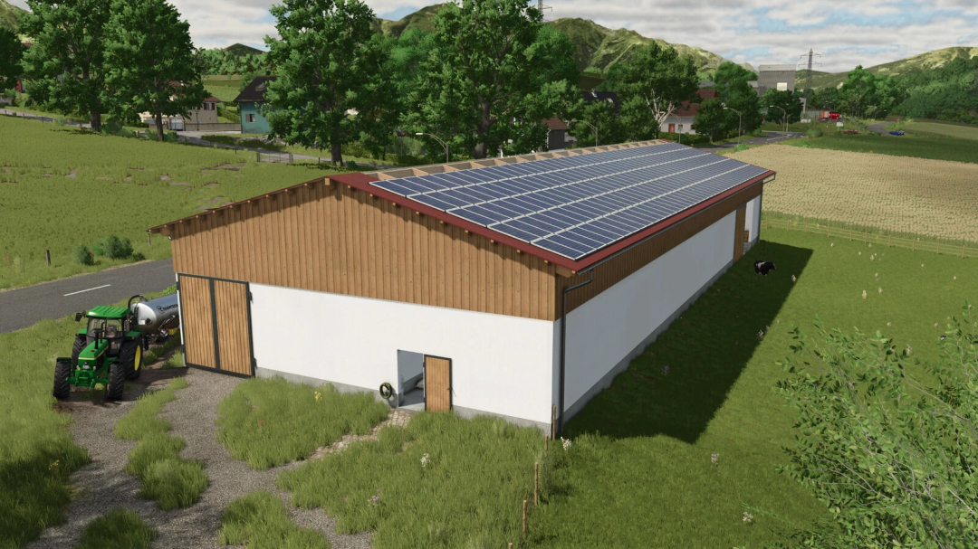 Farming Simulator 25 mod: Modern barn with solar panels, tractor nearby, lush green fields, and rural landscape.