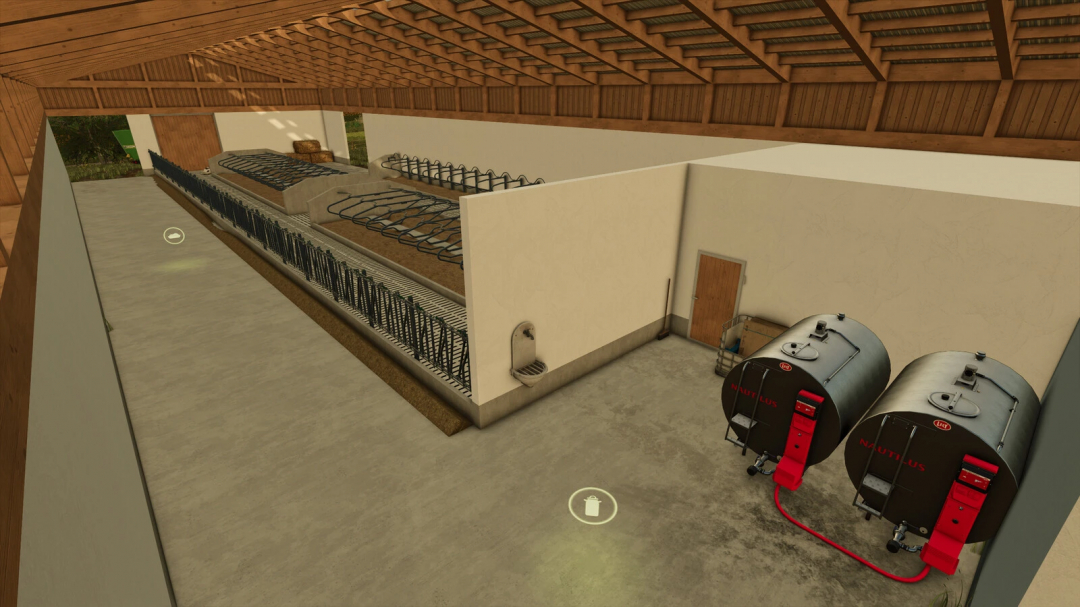 Inside the Bavarian Cowshed in Farming Simulator 25, with feeding troughs, water supply, and fuel tanks for livestock.