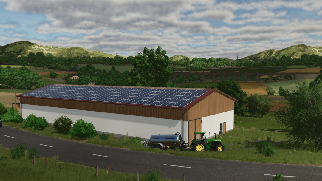 A farm building with solar panels on the roof, tractor, and water tank in a scenic rural landscape, for Farming Simulator 25 mods and FS25 mods.