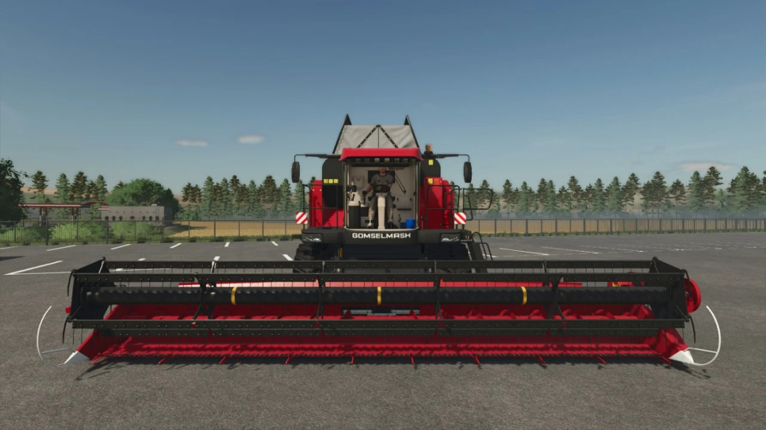 Farming Simulator 25 mod featuring the Palesse GS3219 and ZhSK grain reaper pack v1.0.0.0 in FS25, with a large grain reaping machine on a parking lot.
