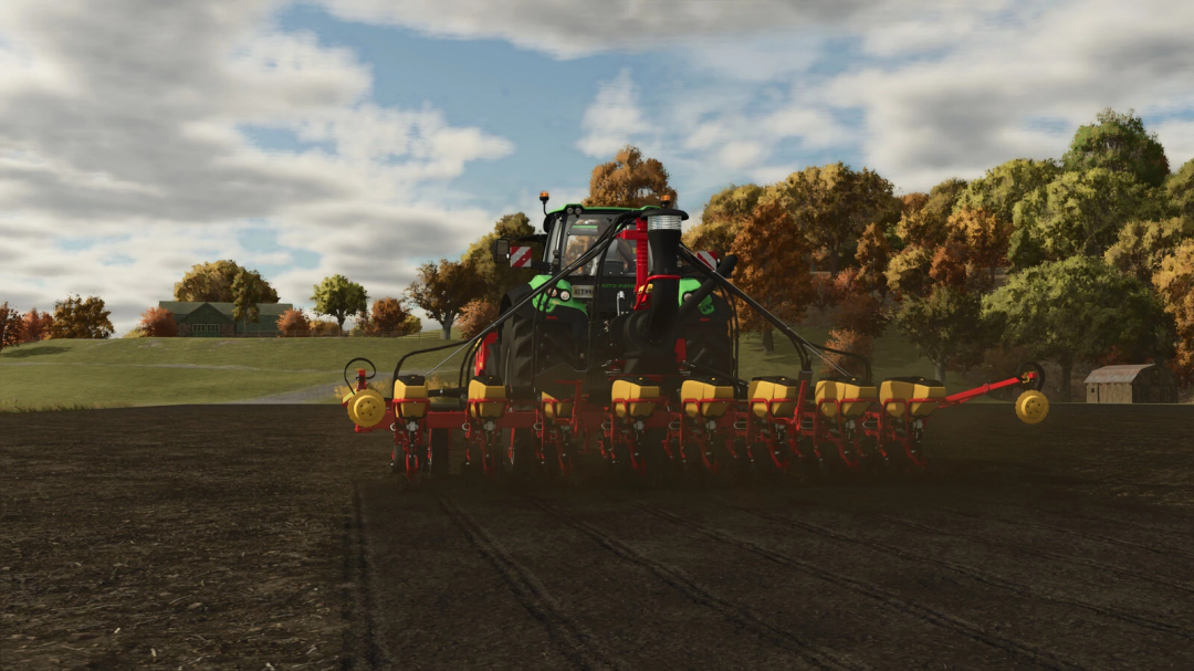 Farming Simulator 25 mod: Väderstad Tempo VTP V8 / FH 2200 in a field during autumn with colorful trees in the background.