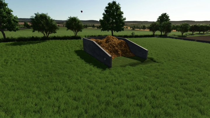 fs25-mods, Farming Simulator 25 mod showing a manure pile in a custom manure sell point with lush green grass and trees in the background.