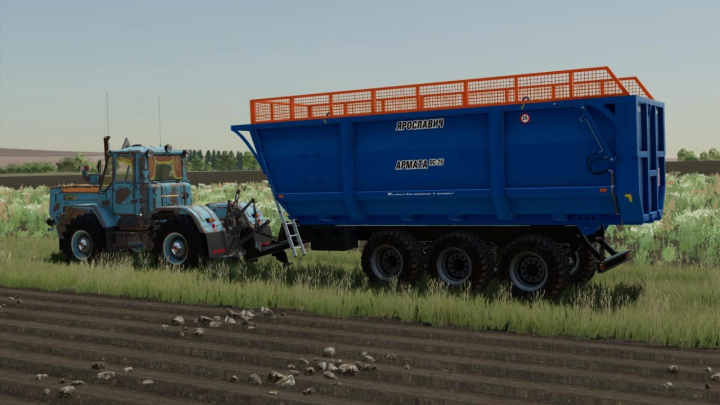 fs22-mods,  Farming Simulator 22 mod showcasing a blue PS-25 Armata trailer attached to a tractor in a rural field.