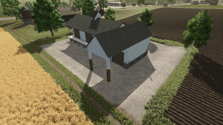 fs25-mods, Farm building with pig food production mod in Farming Simulator 25, surrounded by fields and trees.