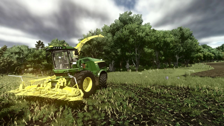 fs25-mods, Farming Simulator 25 mod showcasing a green tractor with a yellow mower attachment, set in a lush farm field with trees and cloudy sky, featuring the Shader MKSH for DLSS v1.0.0.0.