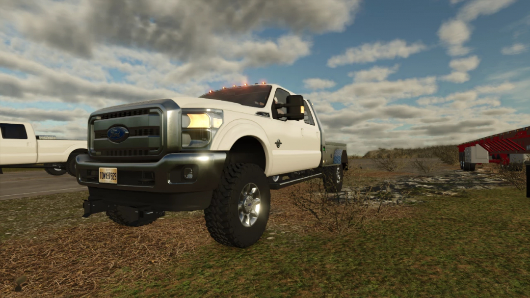 FS25 mod: White Ford F350 truck with lifted suspension in Farming Simulator 25, parked outdoors on a cloudy day.