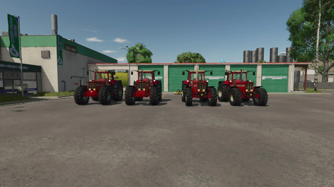 Farming Simulator 25 mods: Four red IHC tractors parked in front of a green garage in FS25.