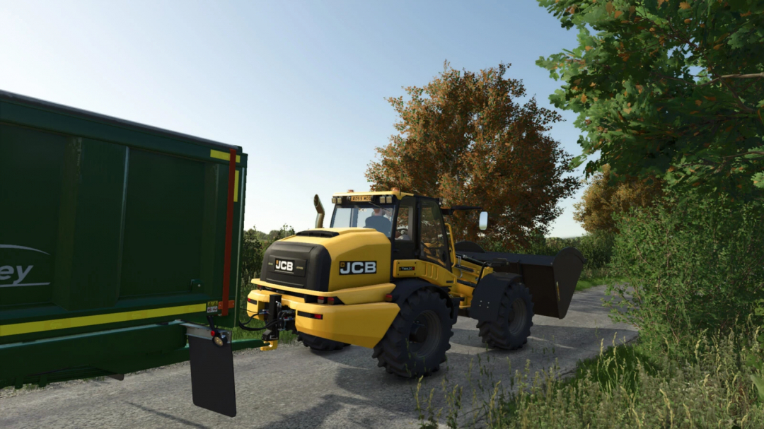 Farming Simulator 25 mods: JCB TM 420S front loader attached to a green trailer on a rural farm road with trees in the background.