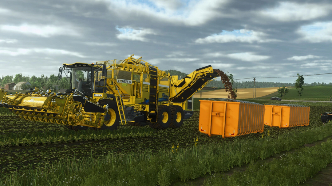 A yellow farming machine from FS25 mods, the Lizard NTG P320 Roll-On, is working in a field, unloading harvested crops into orange storage containers.