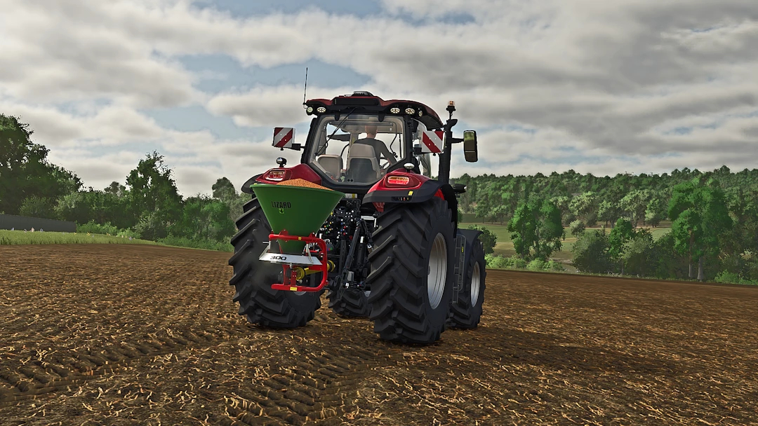 Farming Simulator 25 mod: Lizard S300 Broadcast Seeder attached to a tractor in the field.