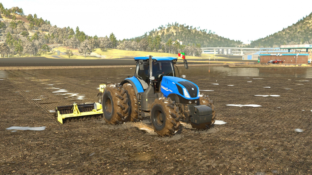 Farming Simulator 25 mod: blue New Holland T7 HD Edition tractor plowing a field with soil and puddles, mountain background.