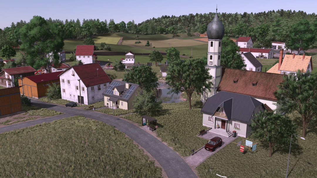 Farming Simulator 25 mods, Oberschwaben v1.0.0.2 mod showcasing a village with houses, trees, and a church, ideal for FS25 mods enthusiasts.