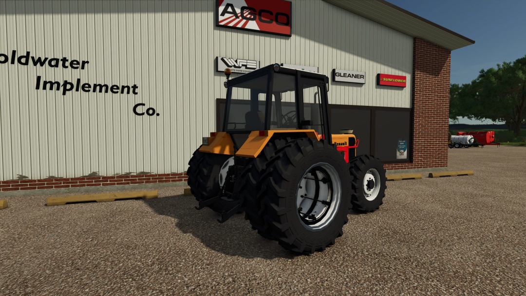 Farming Simulator 25 mod: Renault 103-54 FS25 tractor parked outside an agricultural equipment store.