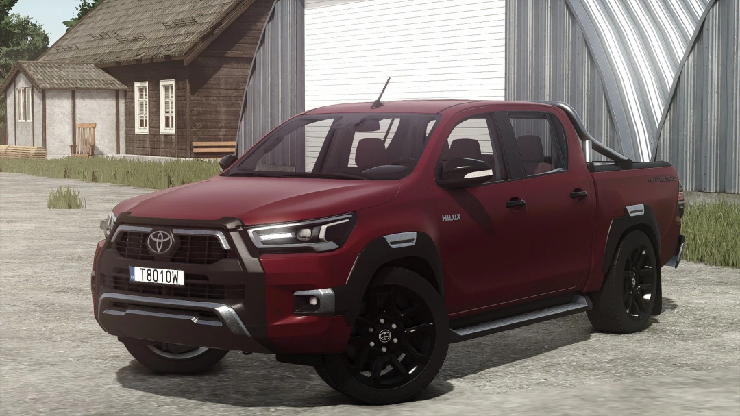 Toyota Hilux Invincible 2021 mod from Farming Simulator 25, shown in red with black wheels, parked on farm yard.