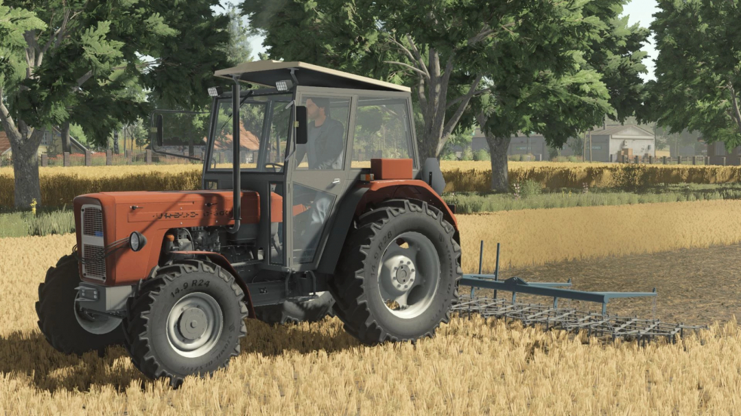 Farming Simulator 25 mod featuring Ursus C355-C360 tractor with attached cultivator in a wheat field, part of FS25 mods collection.
